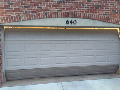 Why You Might Need a Garage Door Replacement Instead of a Repair